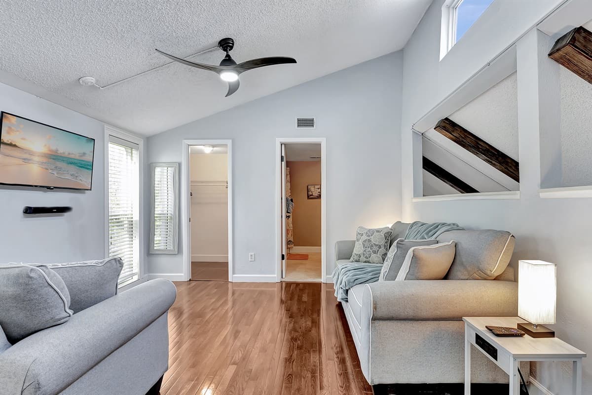 Immerse yourself in comfort with the added convenience of a sleeper sofa in this bedroom, providing the perfect blend of relaxation and functionality.
