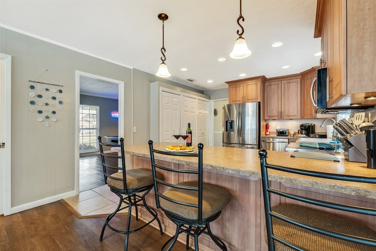 Natural light floods through strategically positioned windows, casting a radiant glow that envelops the space in warmth and comfort.
