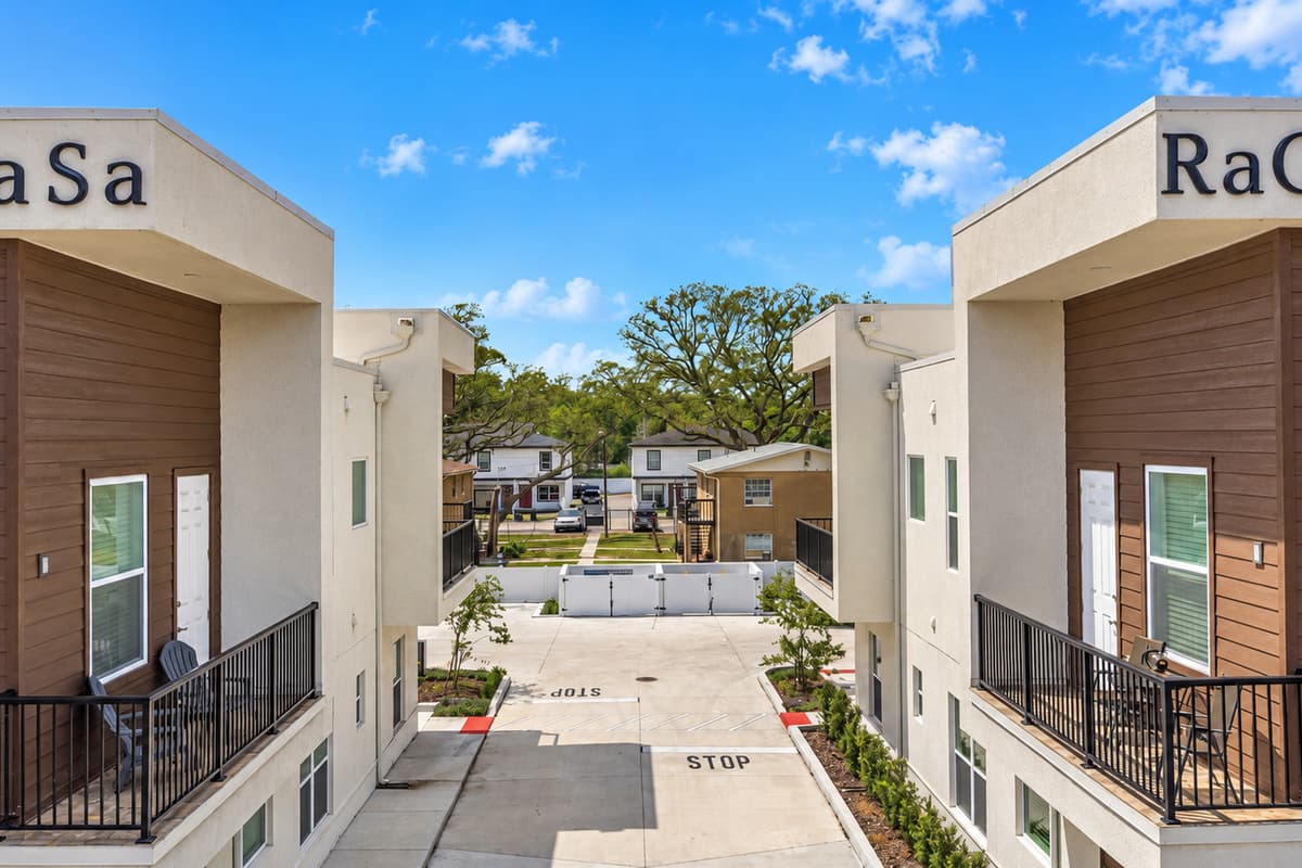 A boutique stay, not a big complex. Just two modern KaSa buildings face each other across a tidy courtyard and parking area. Fewer neighbors and a calmer feel than a big hotel near the University district.