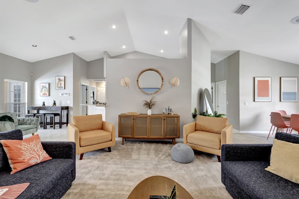 Accompanying the sleek seating options in our living room are charming beige single couches, adding a touch of elegance to the overall ambiance.