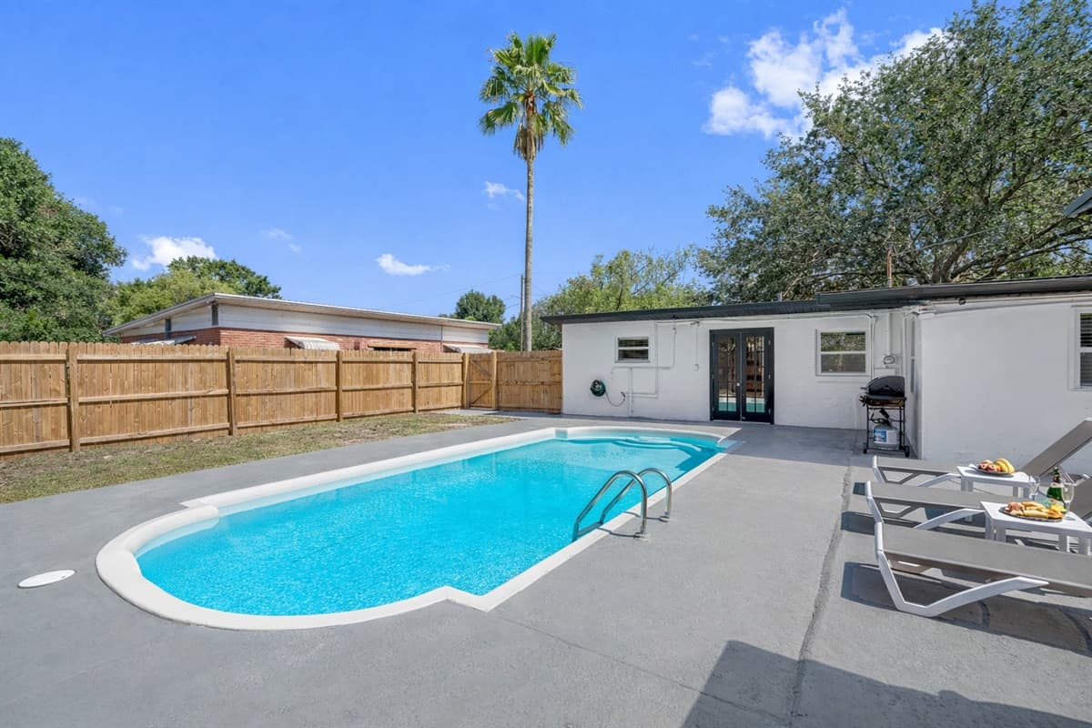 The sparkling waters of the pool beckon you to take a refreshing dip and soak up the sun.