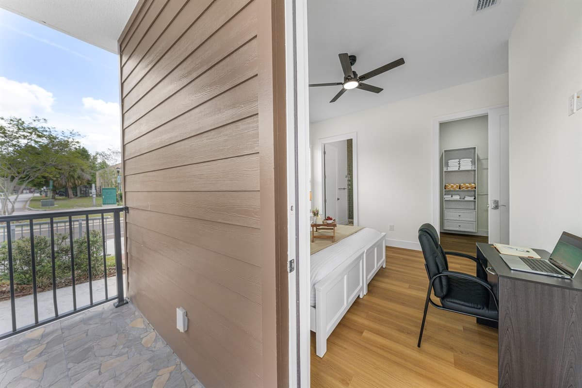 Sliding doors open from the bedroom straight to the balcony — fresh air is always just a step away.