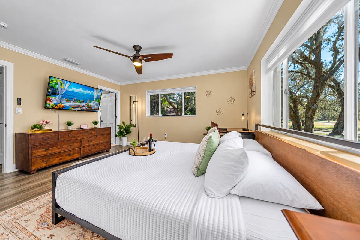 Designed for relaxation, this bedroom features a king bed, warm tones, and a bright, airy layout.