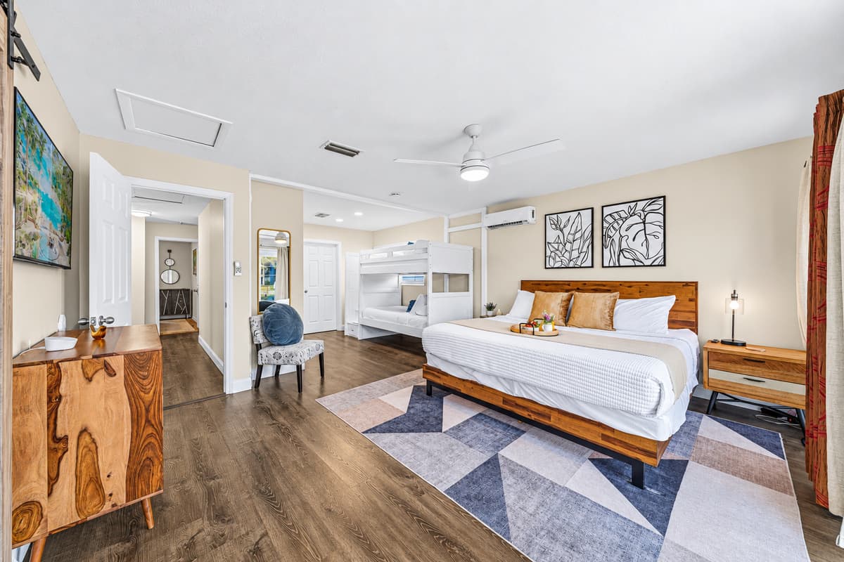Bright and airy bedroom offering comfortable sleeping arrangements for families and groups.