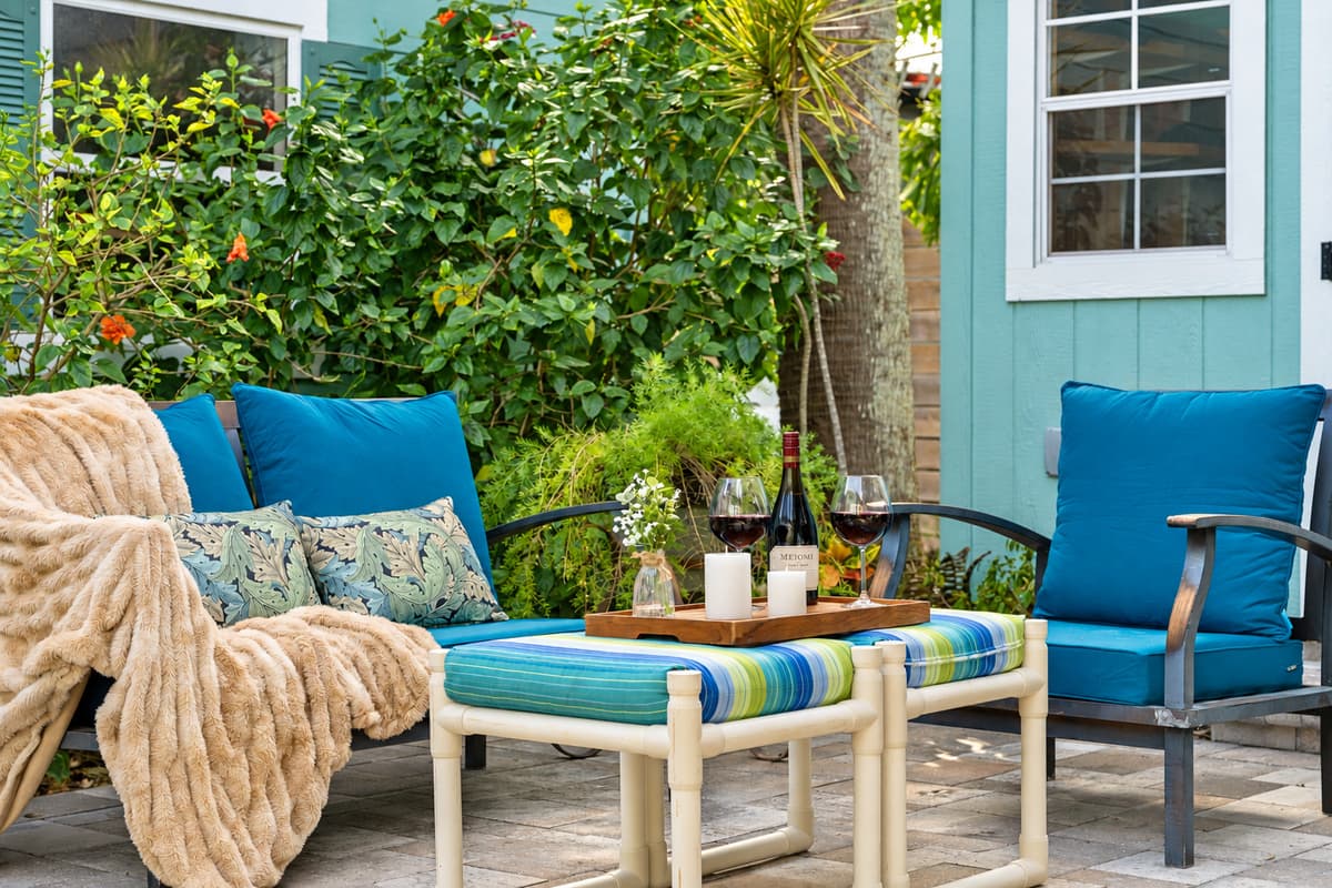 Colorful cushioned chairs and a cozy lounge setup create the perfect spot for enjoying the Florida sunshine.