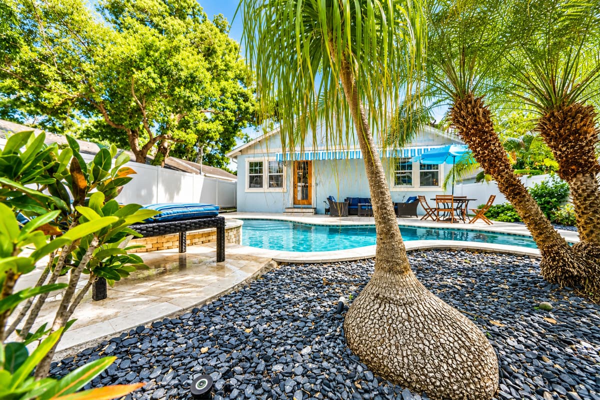 Escape to your own private tropical retreat featuring a sparkling pool, spa, and beautifully landscaped backyard.