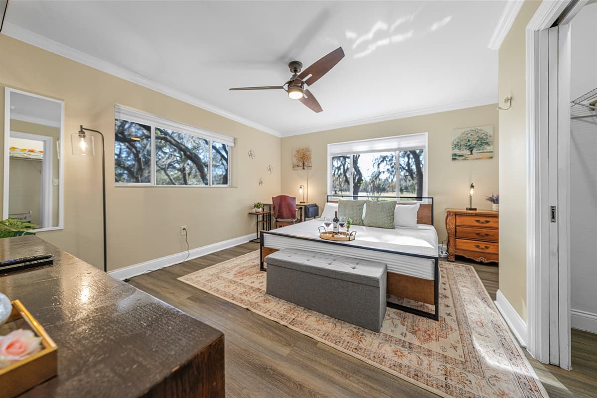 Unwind in this spacious king bedroom, thoughtfully styled with cozy textures, natural light, and a peaceful atmosphere.