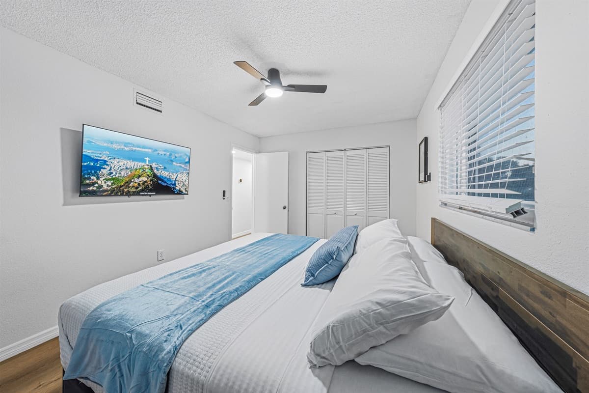 Clean and modern king bedroom with minimalist design and calming neutral palette 