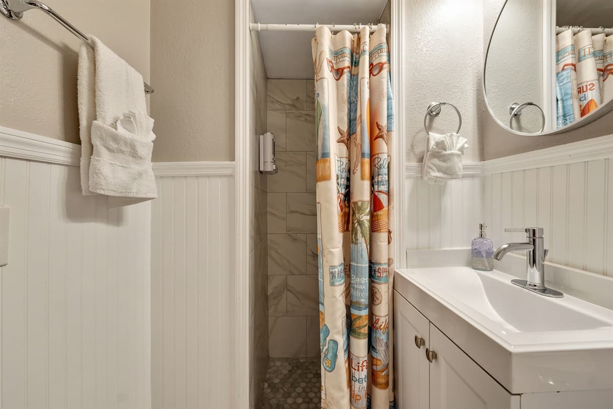 The vanity area is a testament to both practicality and aesthetics.