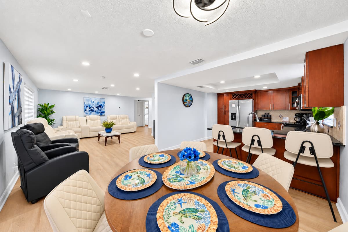 Spacious open floor plan connecting the dining room, kitchen, and living area, perfect for families and groups.