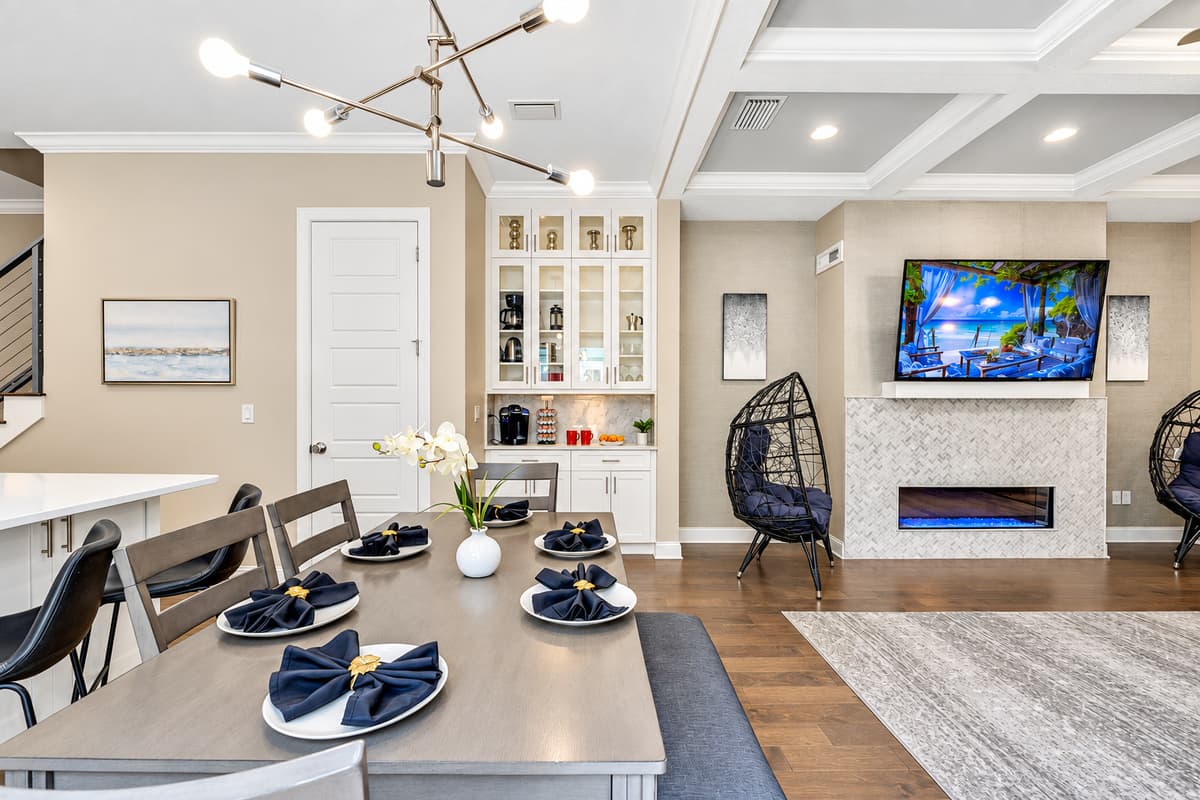 One of the standout features of this dining area is its open-concept design, which allows you to enjoy watching TV while you savor your meals.