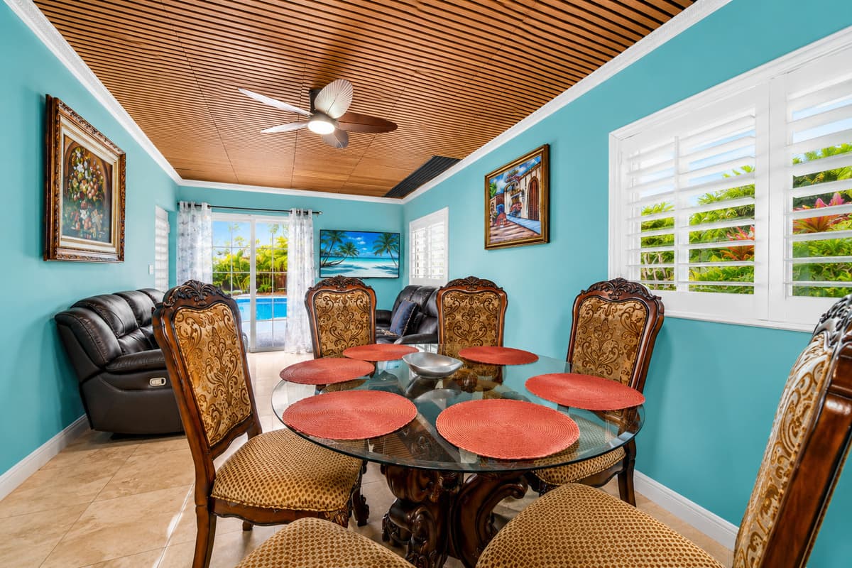 Gather for family meals, celebrations, or game nights in this inviting dining space.