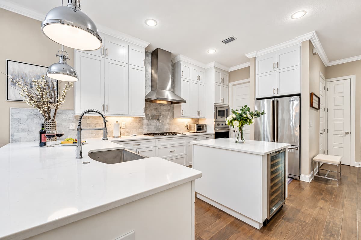 The space flows effortlessly into the adjacent dining and living areas, allowing for easy interaction and connection.