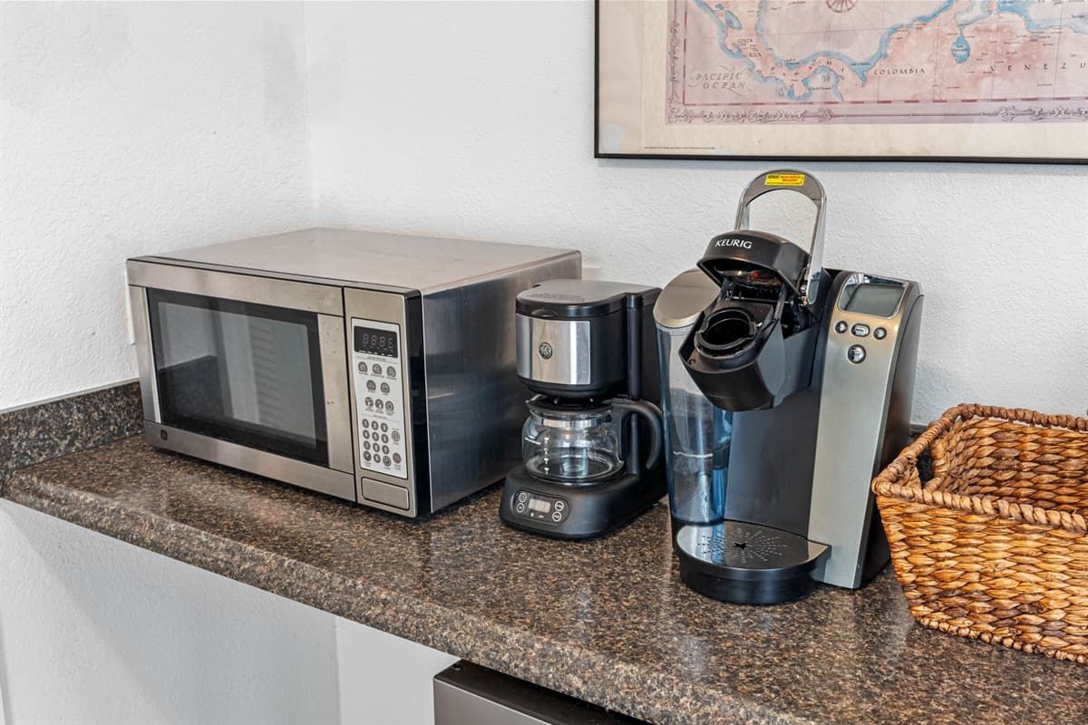 A full suite of high-quality appliances is seamlessly integrated into the space.