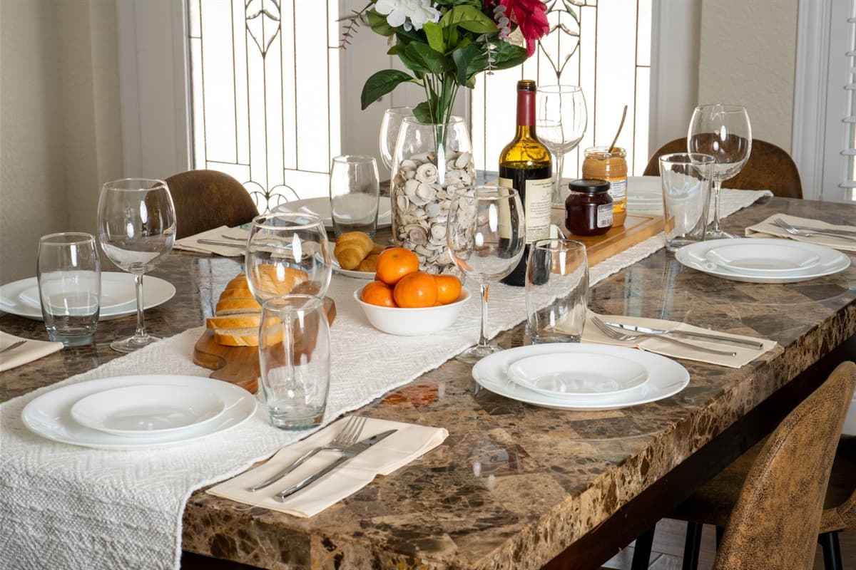 The marble-look tabletop and six comfortable chairs offer both style and practicality for everyday dining or special occasions.