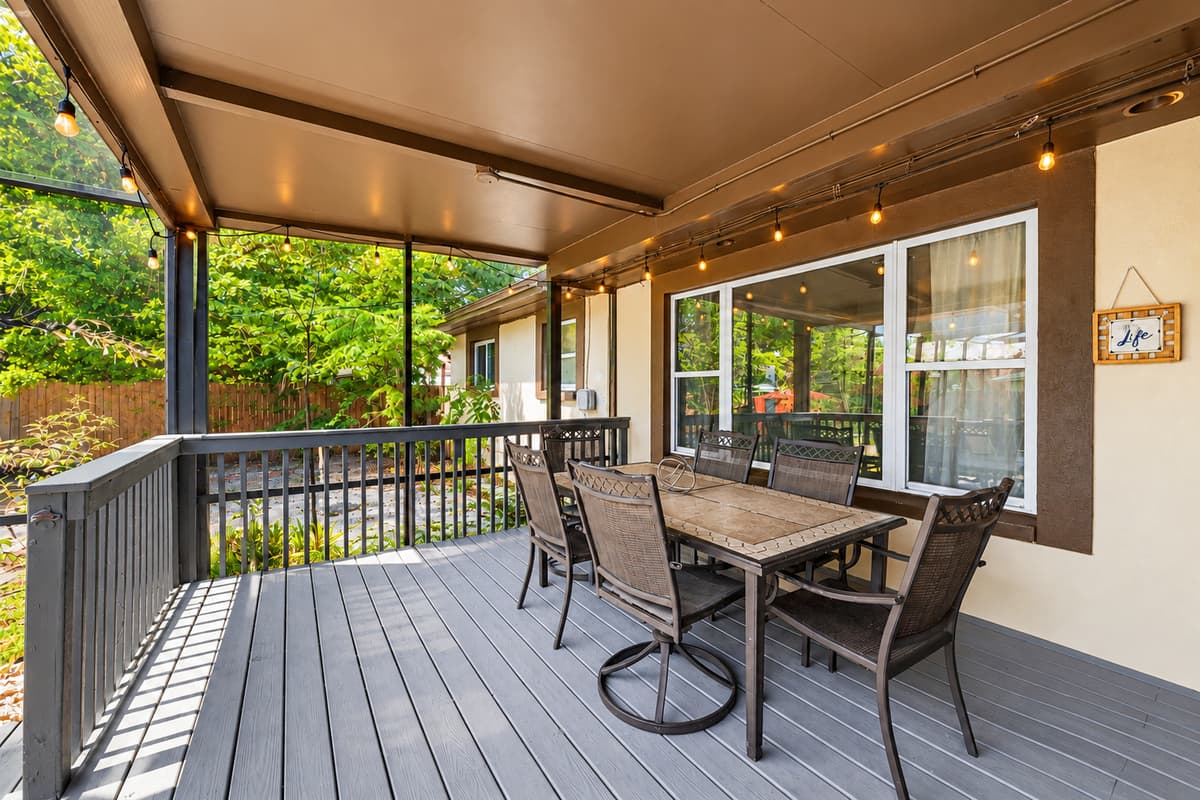 Covered patio dining area perfect for outdoor meals and gatherings with family and friends.
