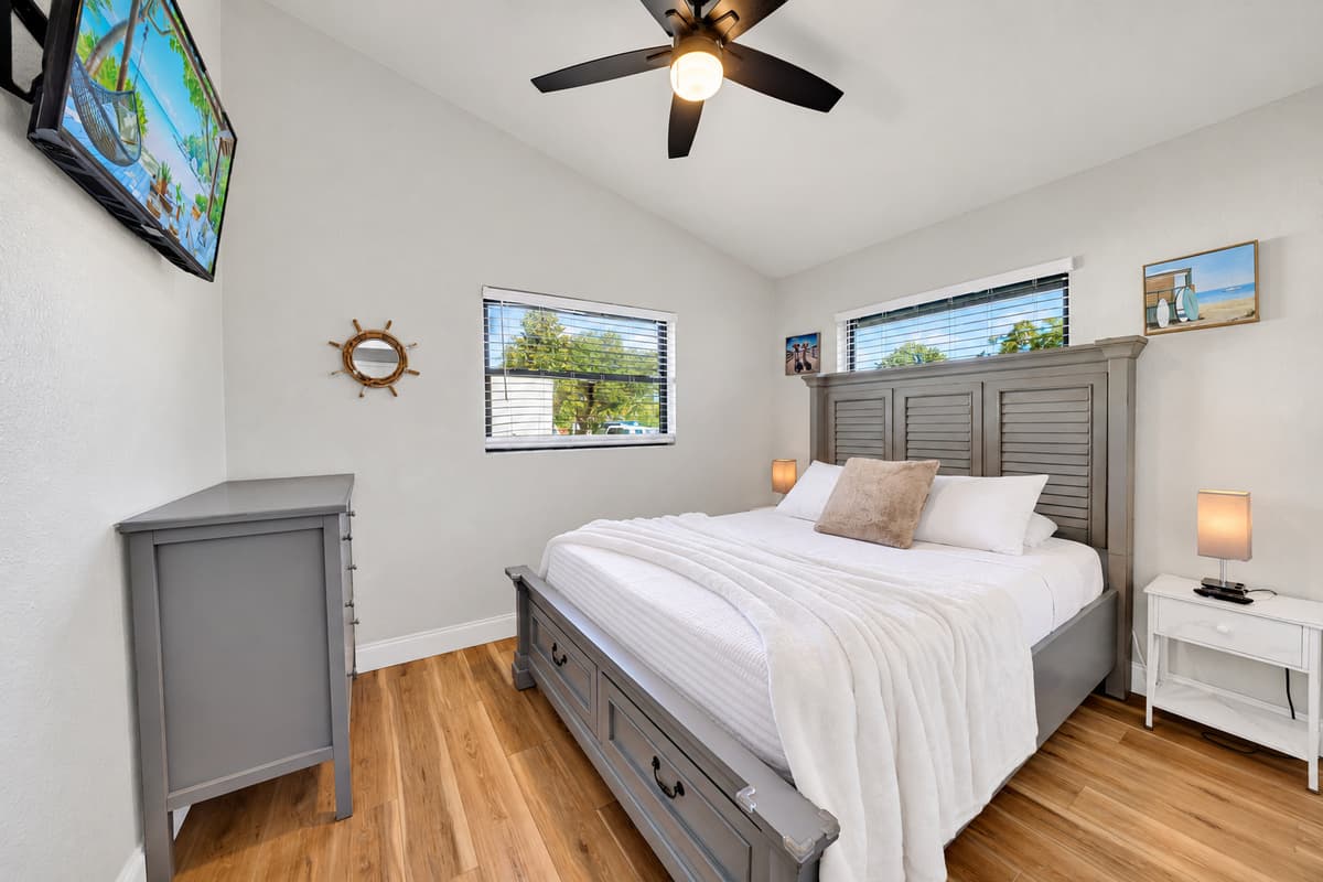 The second bedroom gives another couple a true retreat: a queen bed, Smart TV, ceiling fan, closet and enough room to unpack instead of living out of a suitcase.