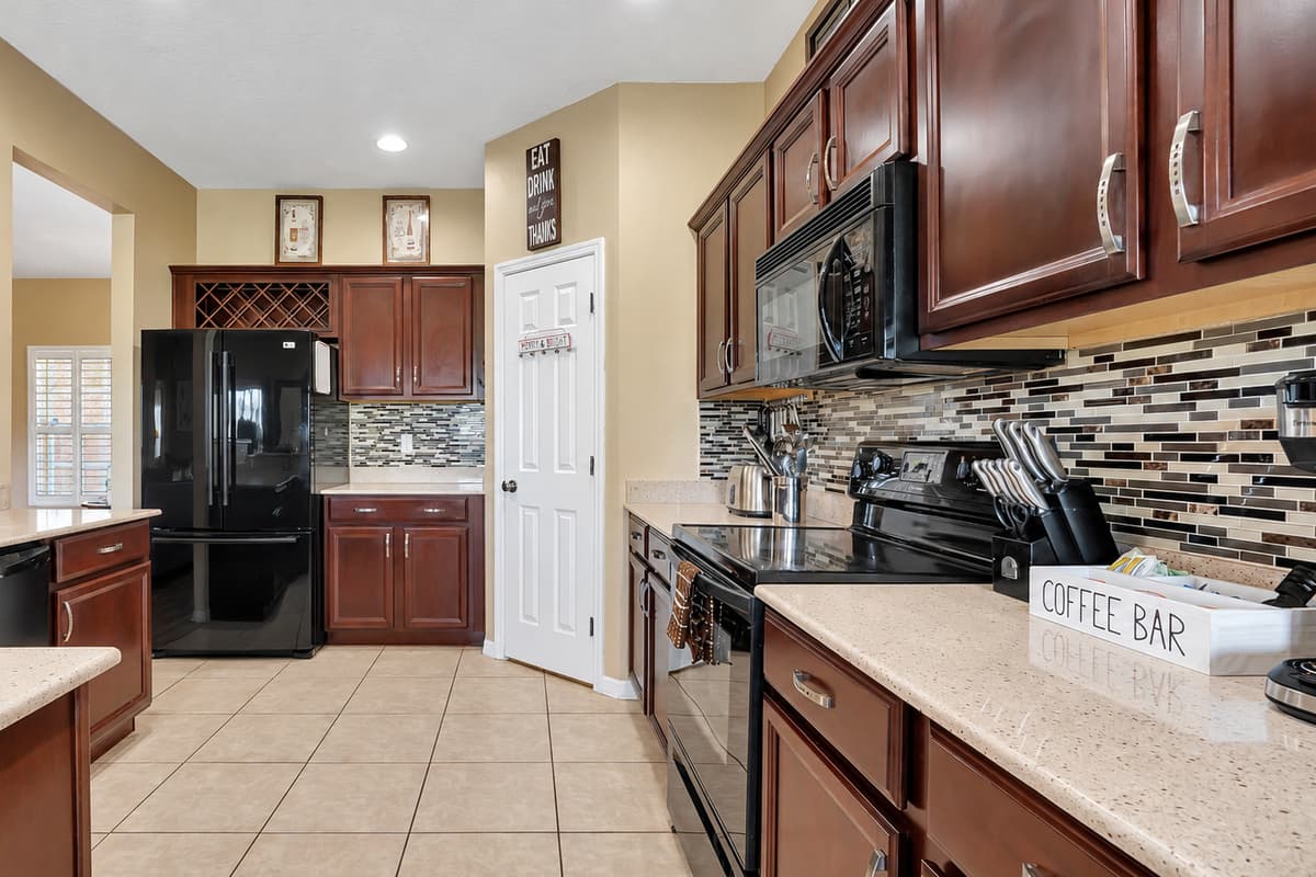 In this open-concept design, the kitchen effortlessly melds with the living room and dining area, fostering an atmosphere of togetherness and connectivity.