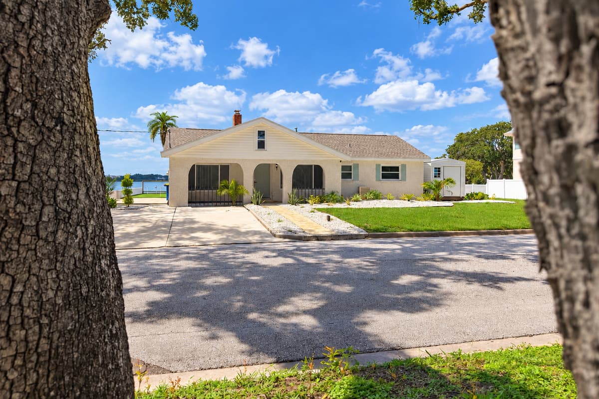 Front exterior and driveway, with parking for three vehicles.