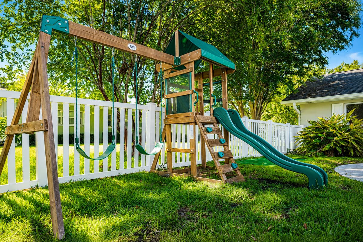A real playground in the backyard — swings, slide, climbing tower. The kids won't ask to go anywhere.