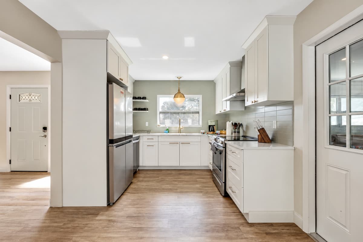 The kitchen is equipped with state-of-the-art appliances that blend seamlessly into the overall design.