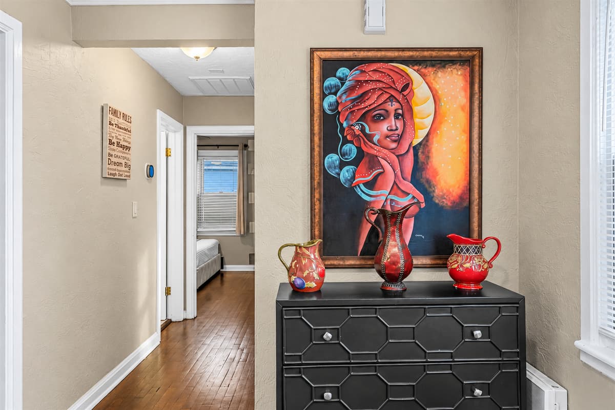 Tastefully decorated hallway with artwork and accents adding character to the home.