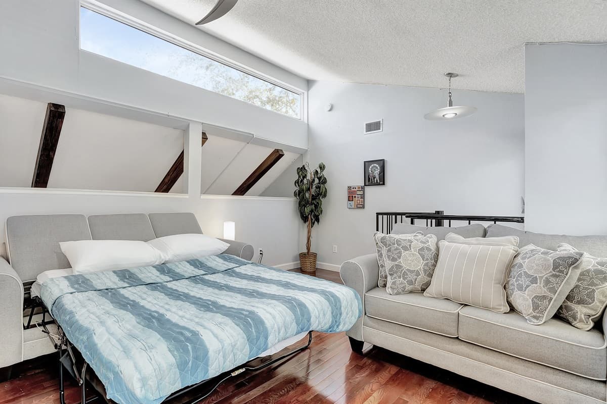 Escape to ultimate relaxation in our cozy bedroom retreat, where the luxury of comfort meets the practicality of a sleeper sofa.