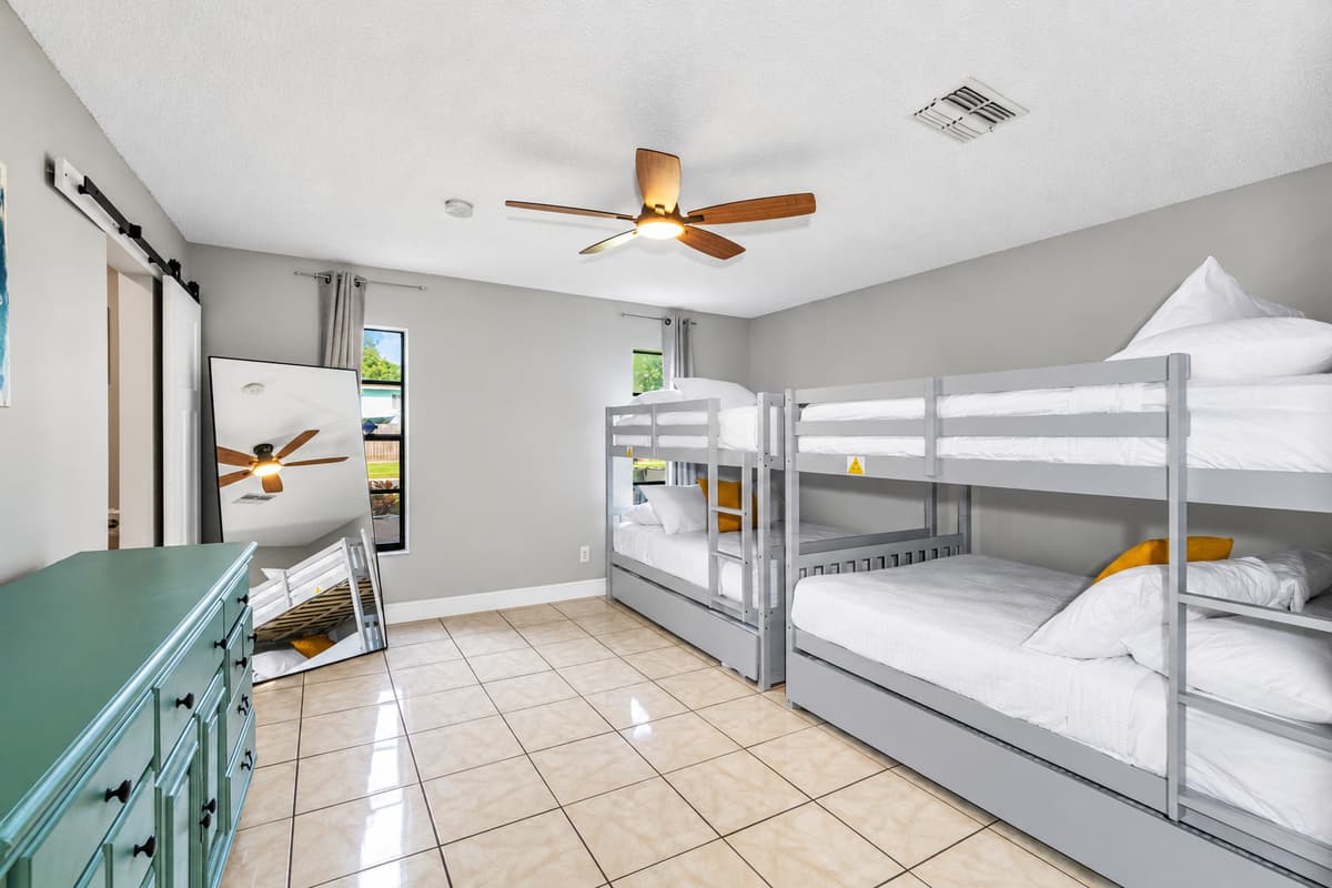 Whether you’re traveling with kids, cousins, or a crew of friends, this generously sized bunk room offers the perfect blend of comfort, space, and playful charm.