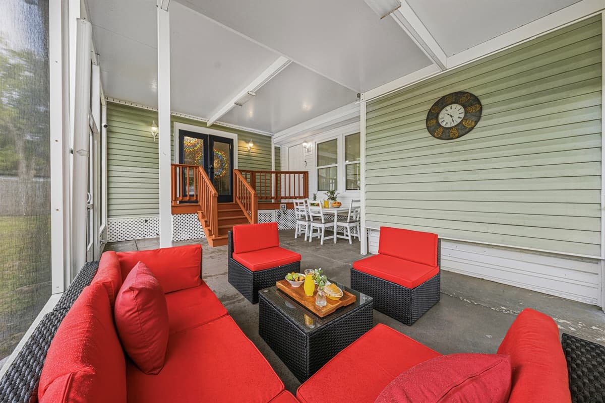 Covered outdoor patio with comfortable seating—ideal for relaxing and socializing.