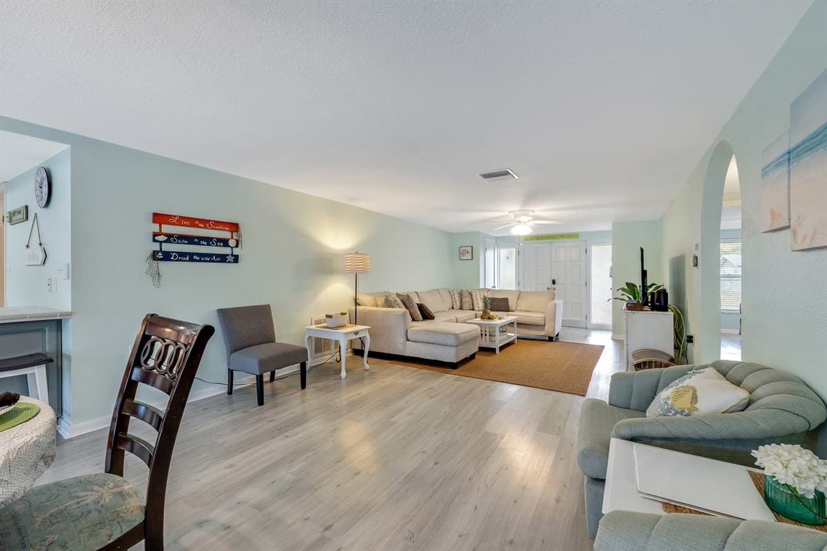 As you settle into the plush comfort of the grey couch, you'll find that every detail has been considered to elevate your experience.