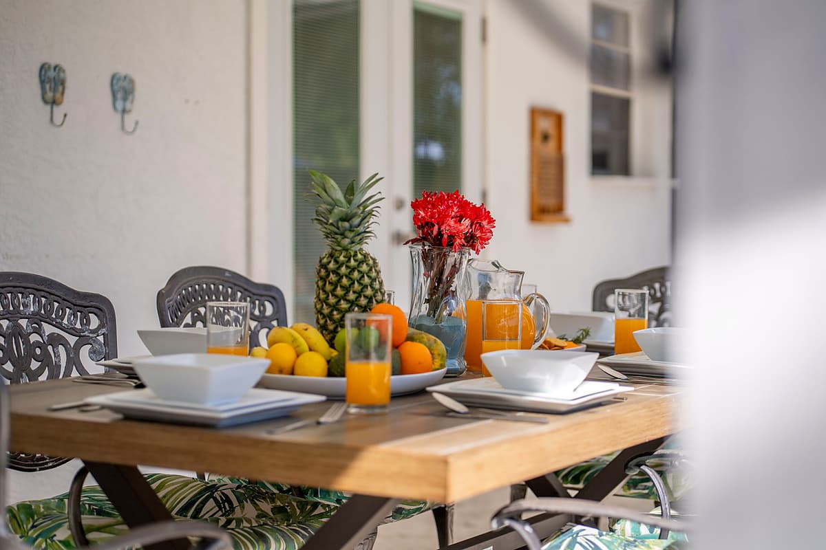 Thoughtfully positioned for easy access, this inviting space allows guests to enjoy al fresco dining while overlooking the sparkling pool.