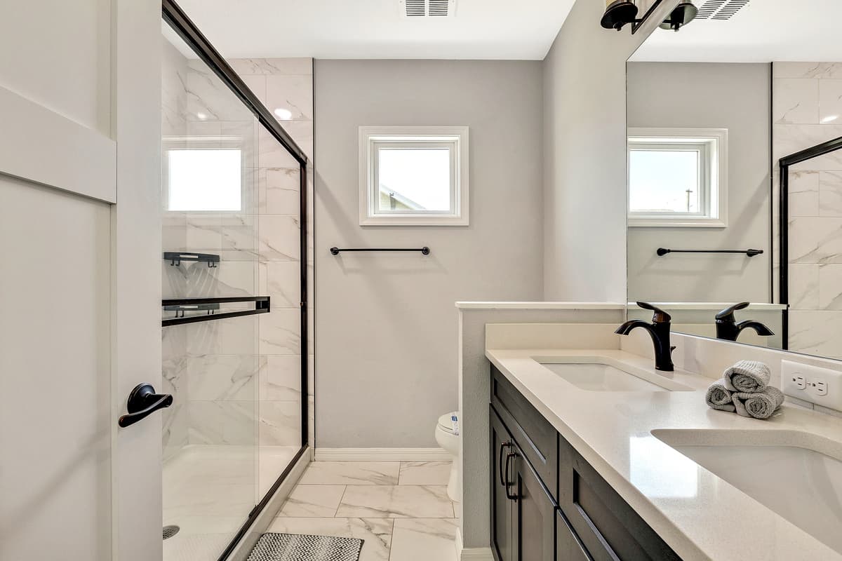 Whether you prefer a refreshing morning shower or a relaxing evening bath, the ensuite provides the perfect space to unwind.