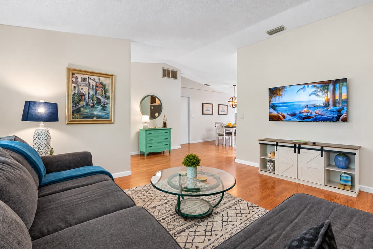 The comfortable lounging couch create an inviting atmosphere, perfect for unwinding after a long day or hosting memorable movie nights with loved ones.