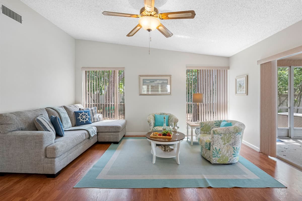 The second living room is thoughtfully designed to offer both style and comfort, featuring a chic L-shaped couch that serves as the room's centerpiece. 