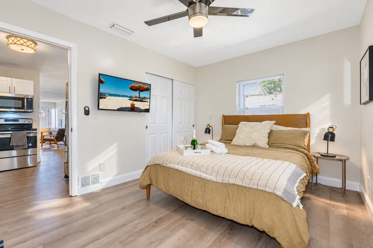 Exquisite bedroom with queen size bed, closet, vanity, and smart TV. Feel comfortable during your stay while making wonderful memories with family and friends. 