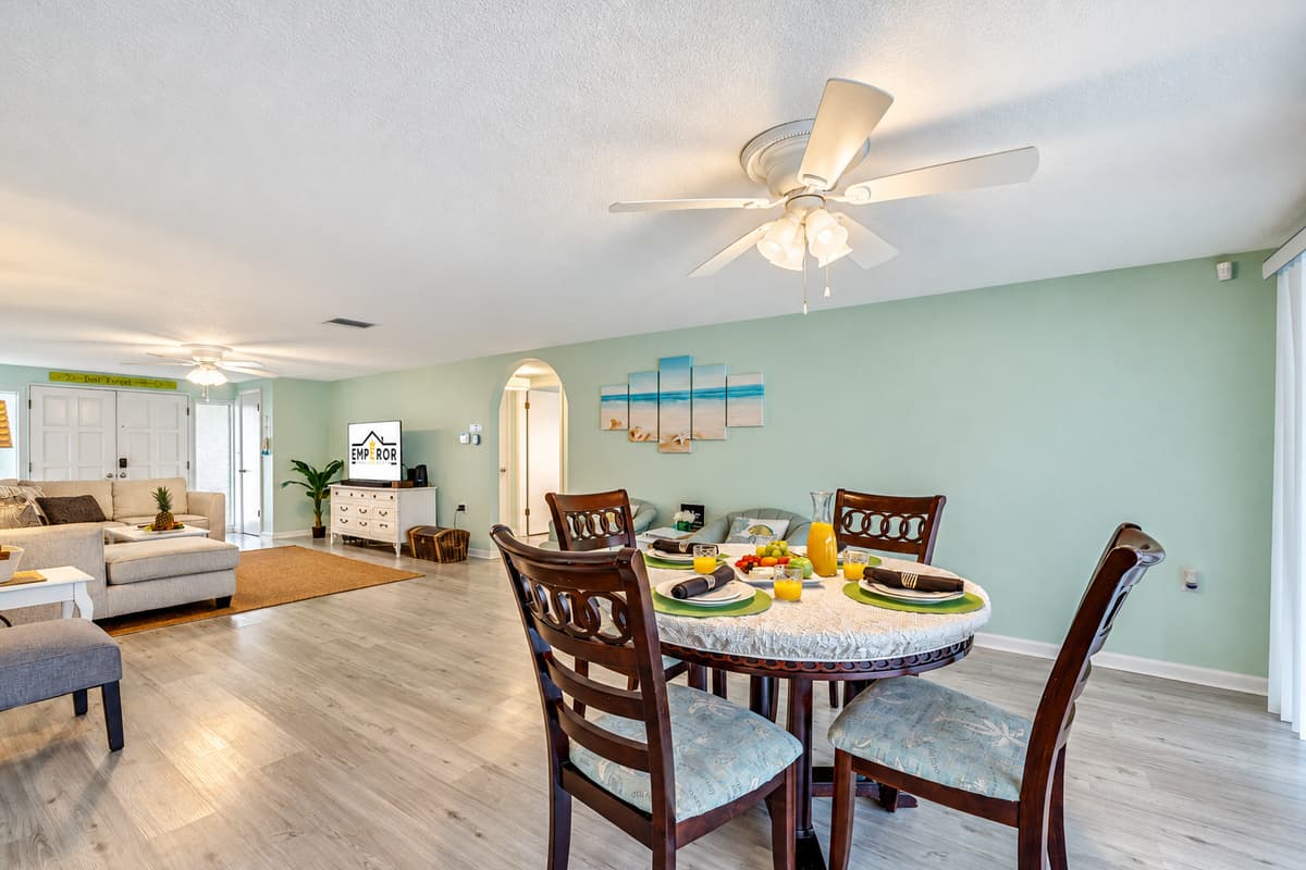 Nestled in an open layout, this dining haven seamlessly connects to both the kitchen and living area, creating a harmonious flow throughout the space.