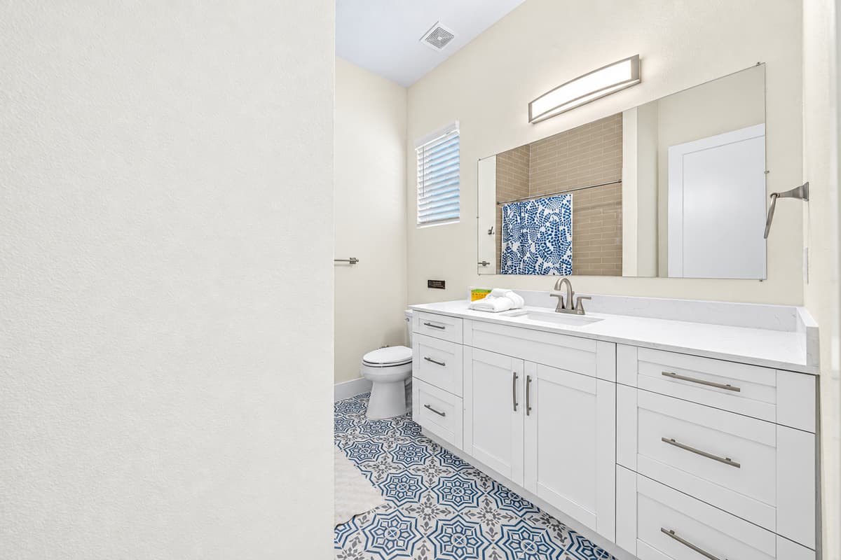Double vanity bathroom with ample counter space and modern finishes.