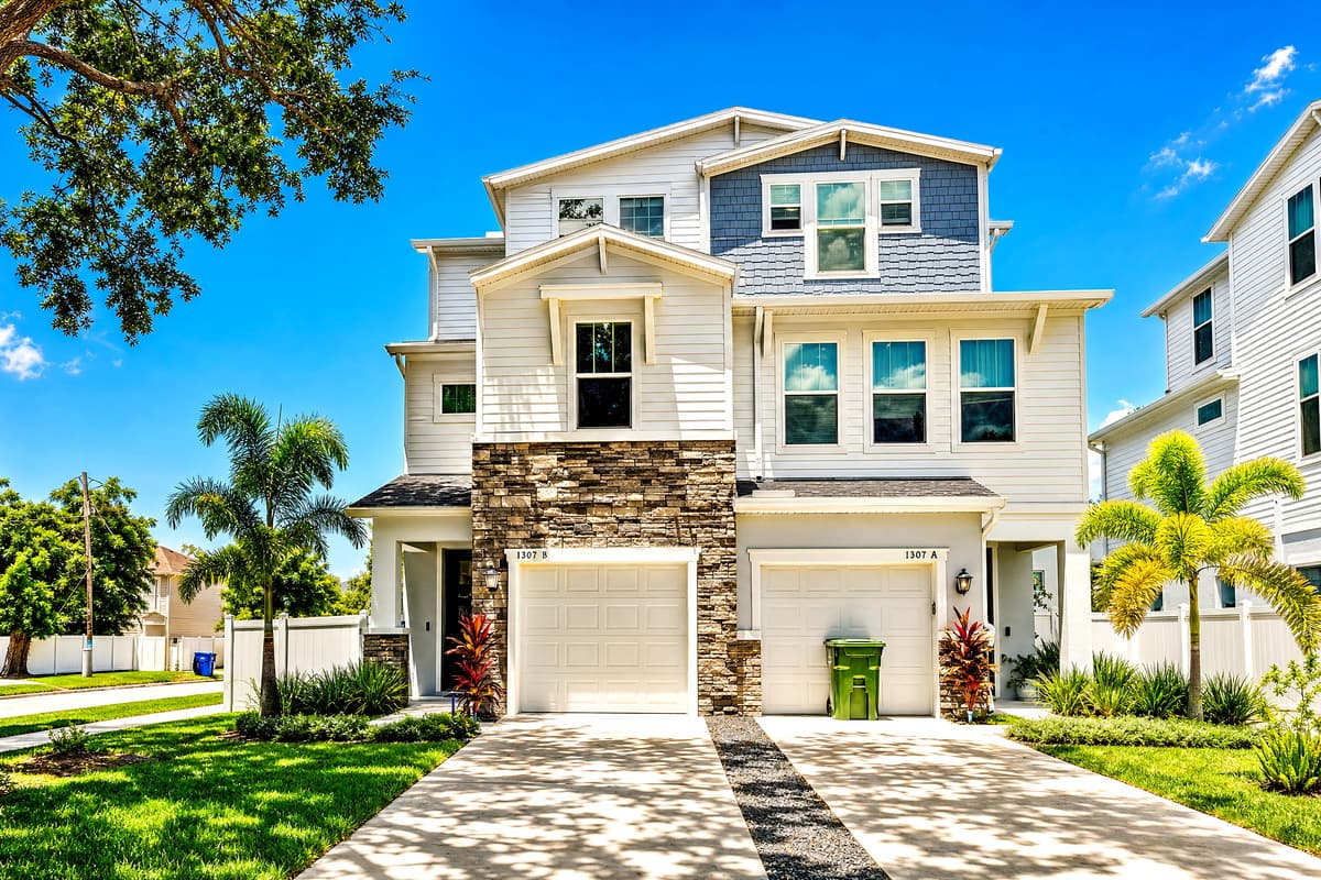 Three floors, and the whole thing is yours. Pull into the driveway, walk past the palms, open the front door — nobody else has a key.