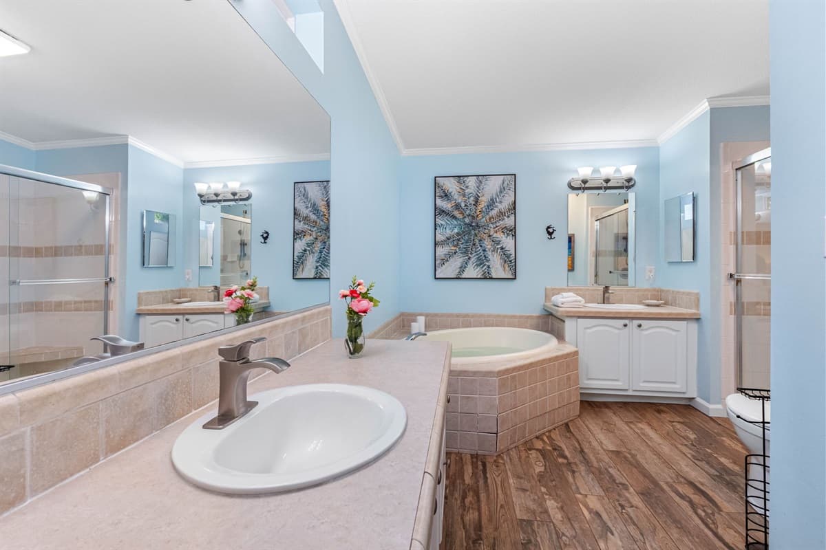 This expansive master ensuite offers a serene, spa-like atmosphere designed for total relaxation.