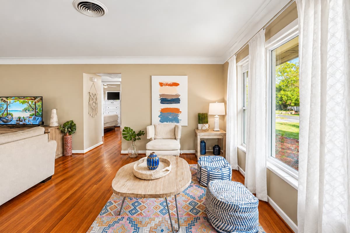 Open living space featuring comfortable seating, breakfast bar access, and spacious common areas.