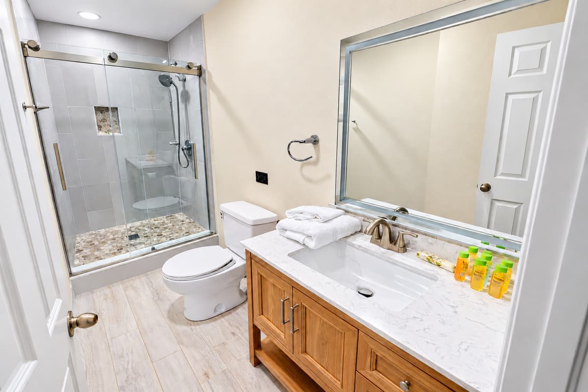 The light wood-look flooring and neutral color palette create a calm and welcoming atmosphere.