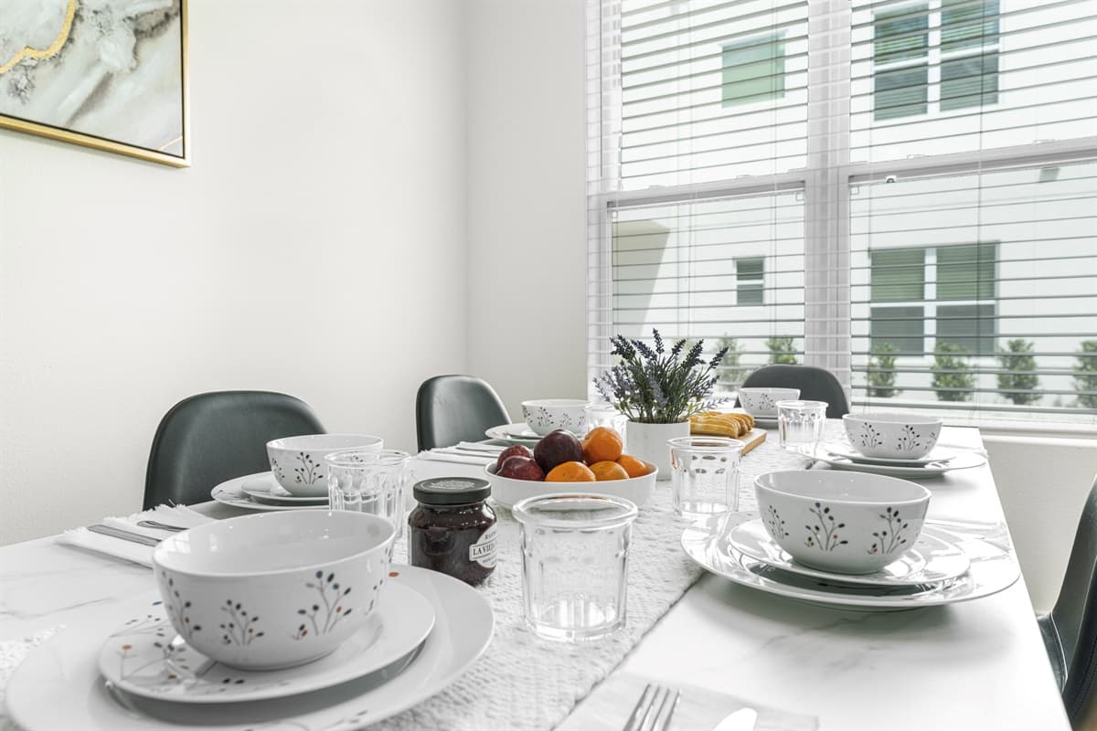 Enjoy breakfast at the dining table with views of the lush greenery just outside.