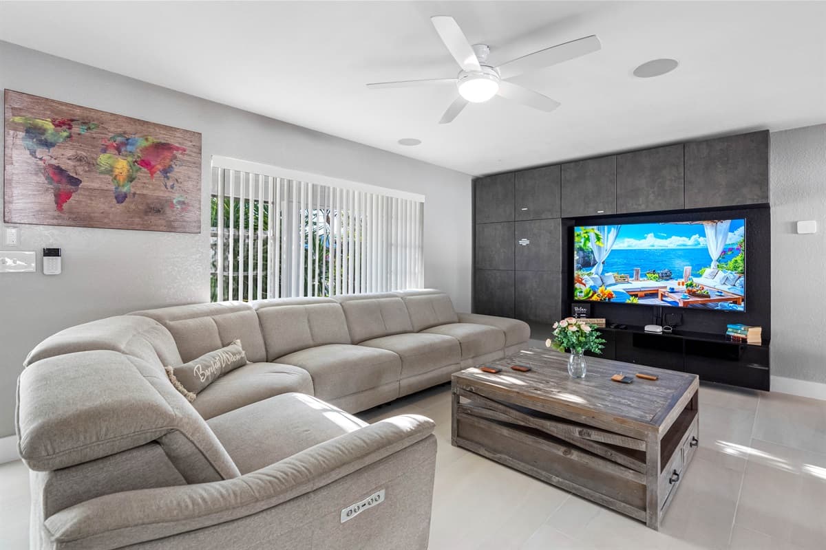 Spacious living room with comfortable modern couch where you and your family and friends can bond and relax.