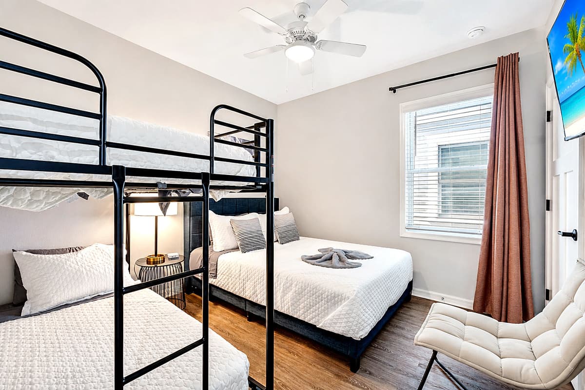 The bedroom is a symphony of tasteful decor and thoughtful furnishings, creating an ambiance that is both stylish and welcoming.