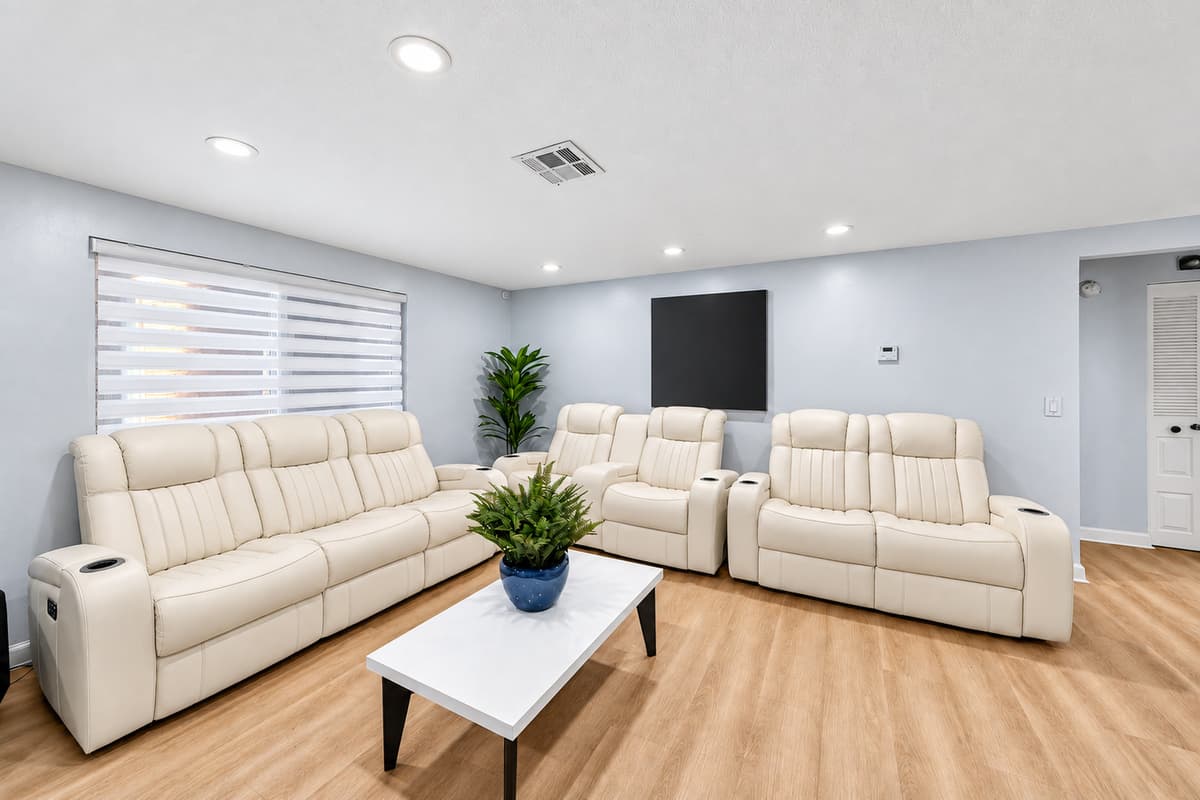Comfortable lounge area with plush recliners and contemporary furnishings, perfect for unwinding after a day of exploring Tampa.