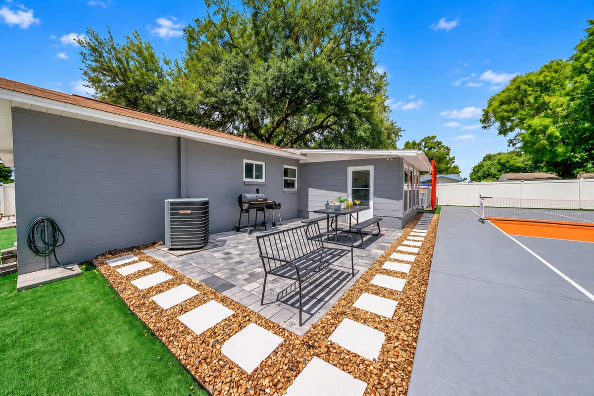 Enjoy outdoor dining and lounge seating just steps from your private pickleball court—perfect for relaxing between games.