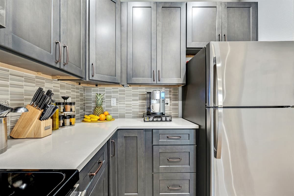 The clean lines, contemporary finishes, and tasteful decor create a modern aesthetic, making the kitchen a visually appealing space that complements the overall design of the home.
