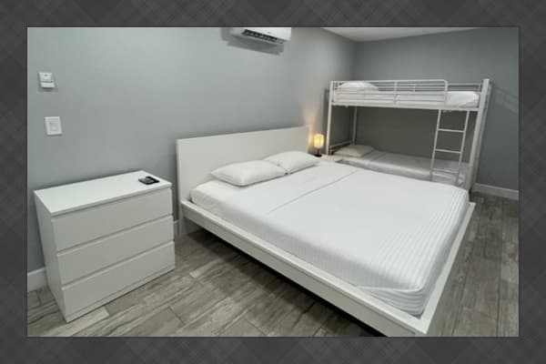 Enjoy a bright and contemporary space equipped with a king bed and a twin bunk bed, ideal for adults and kids alike. *Updated photos will be added soon!