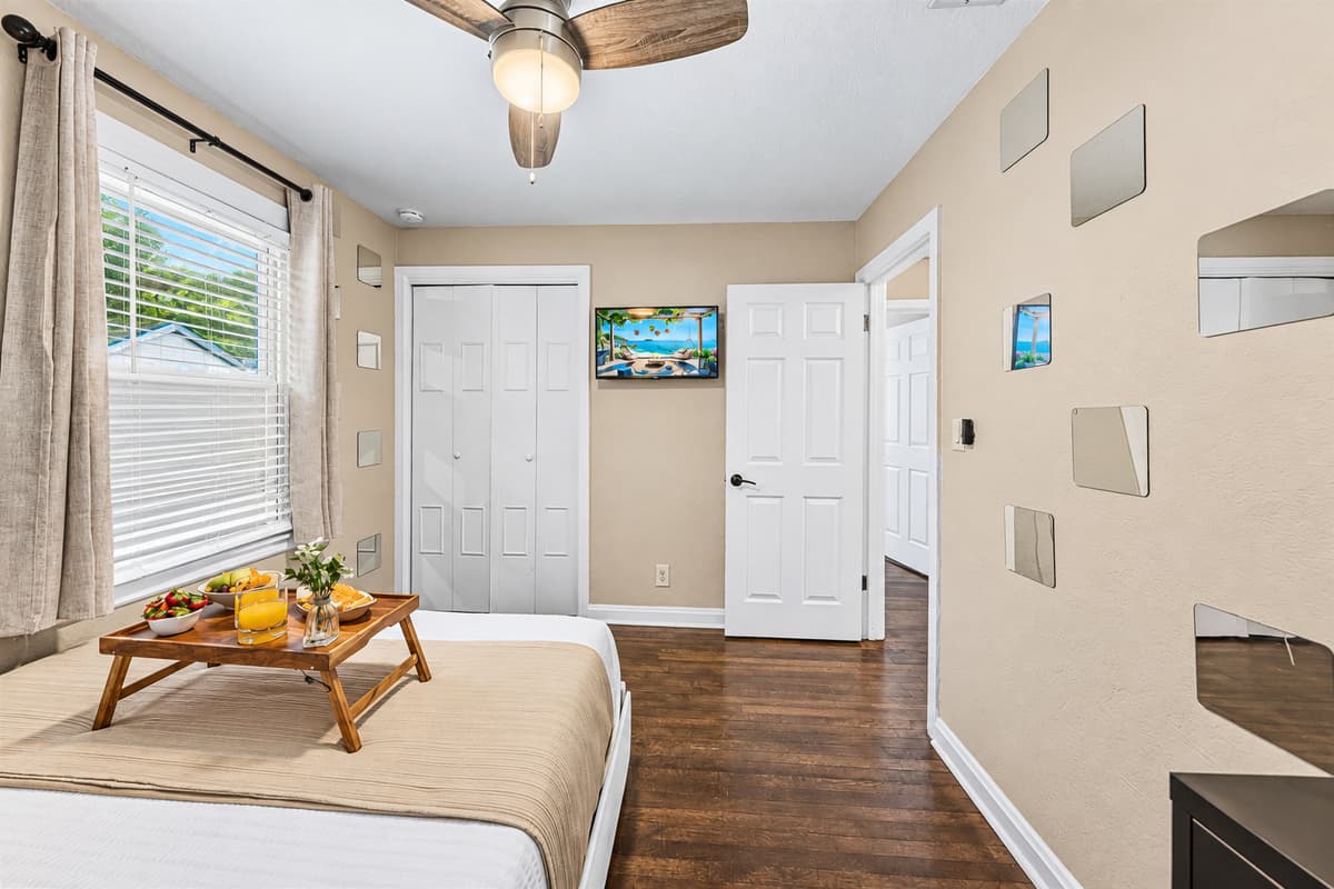 Spacious bedroom with cozy bed, seating area, and inviting ambiance for ultimate comfort.
