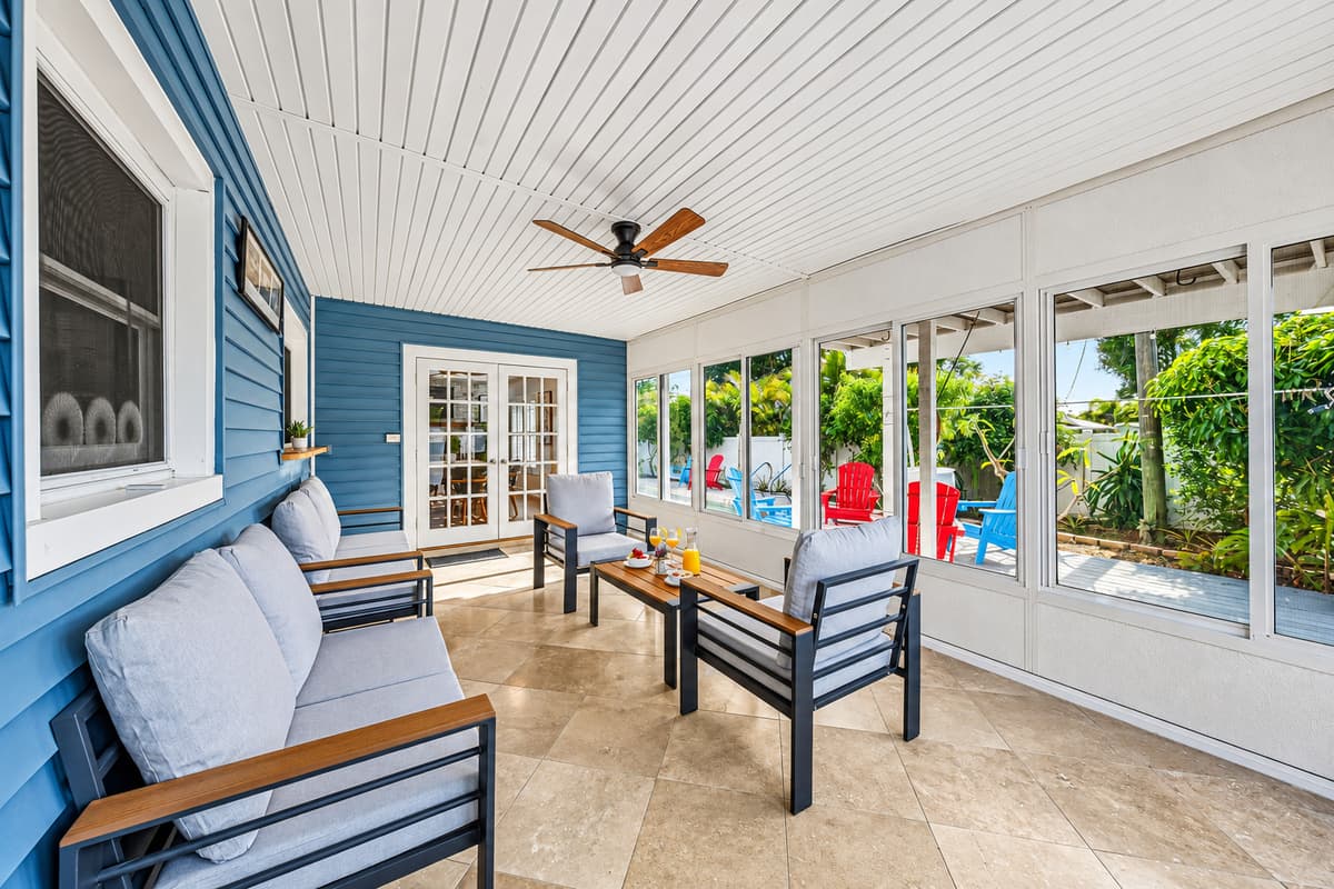 Stylish enclosed patio with comfortable lounge seating—perfect for morning coffee or evening relaxation 